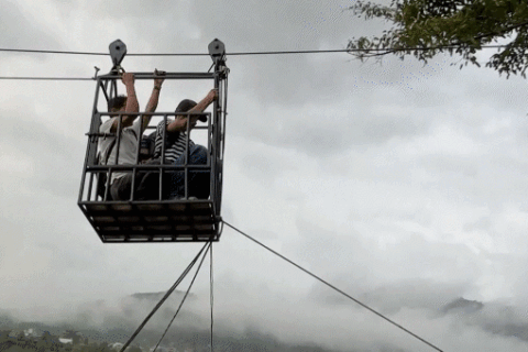 Rescuers use ziplines to transport trapped citizens after devastating Nepal floods decimate country's bridges